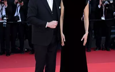 John Travolta's Cannes Style Evolution: From Acting Icon to Beret-Clad Director